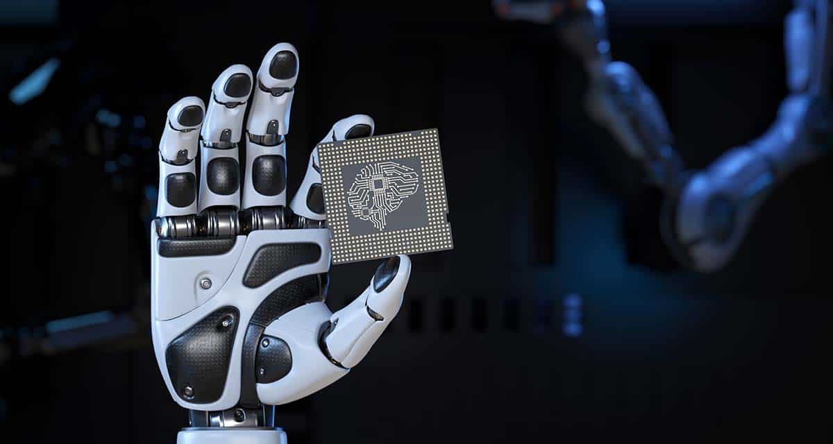 Robotic hand holding AI microchip with digital brain circuitry