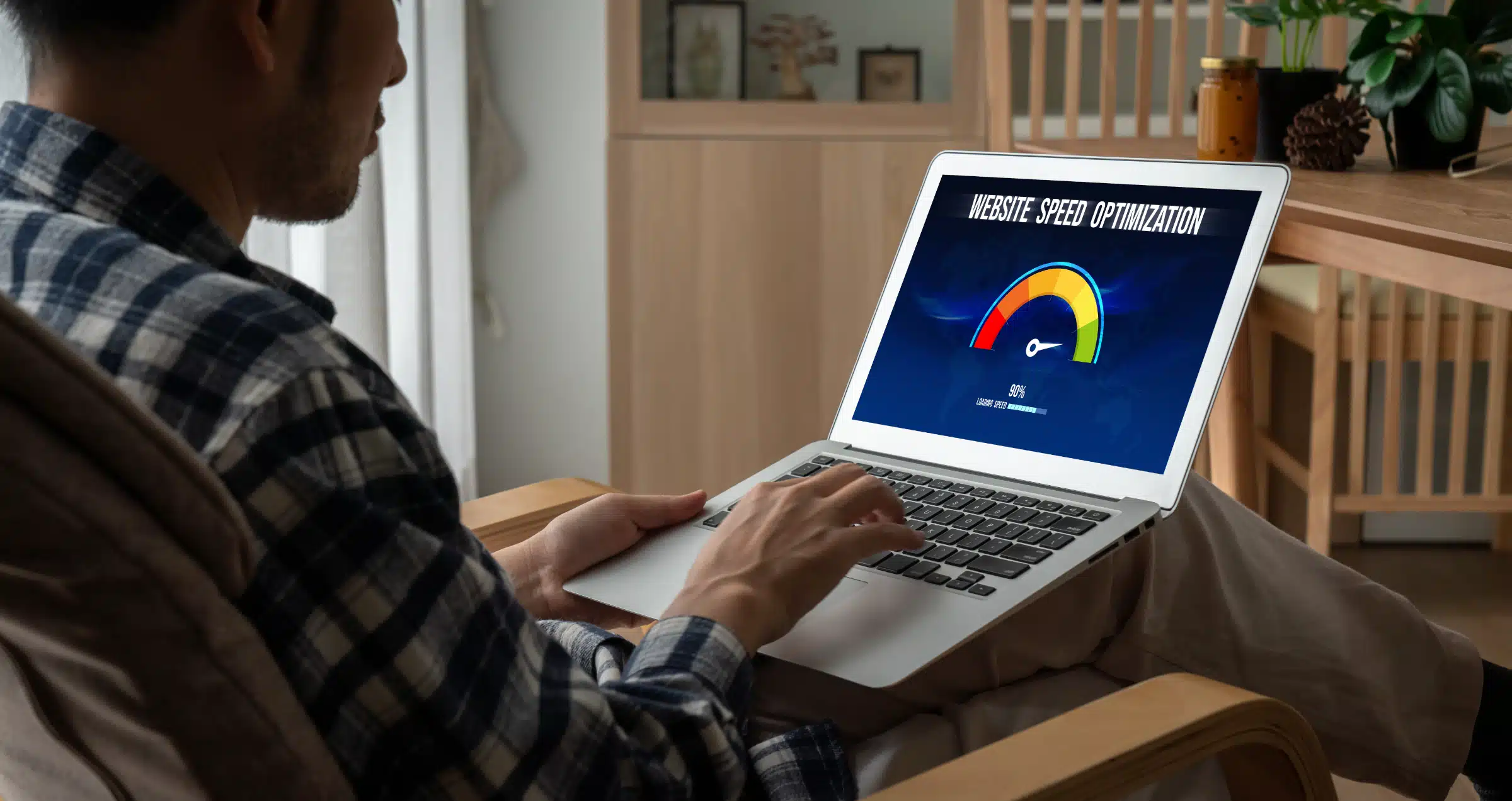 Man working on website speed optimization on laptop